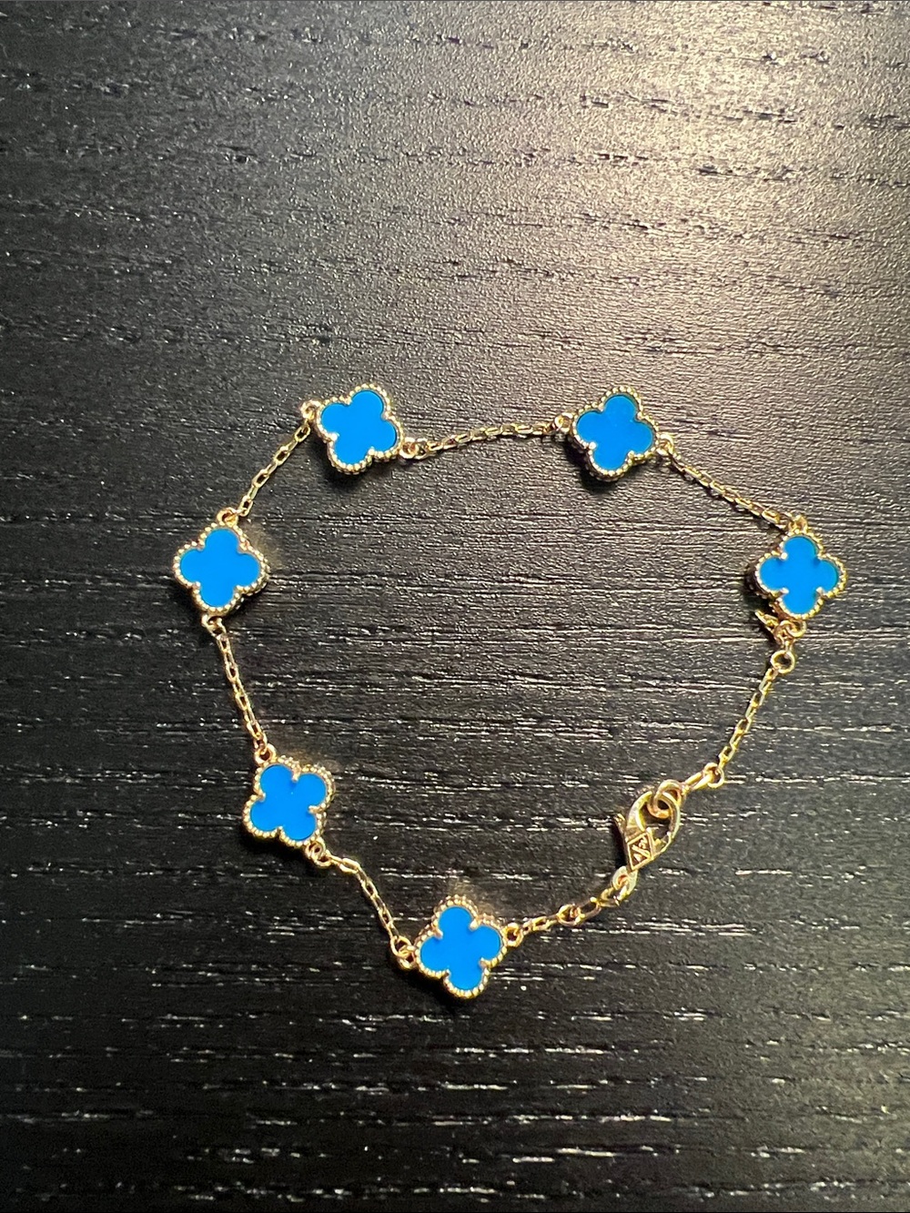 Gold-Tone Bracelet with Bright Blue Clover Charms